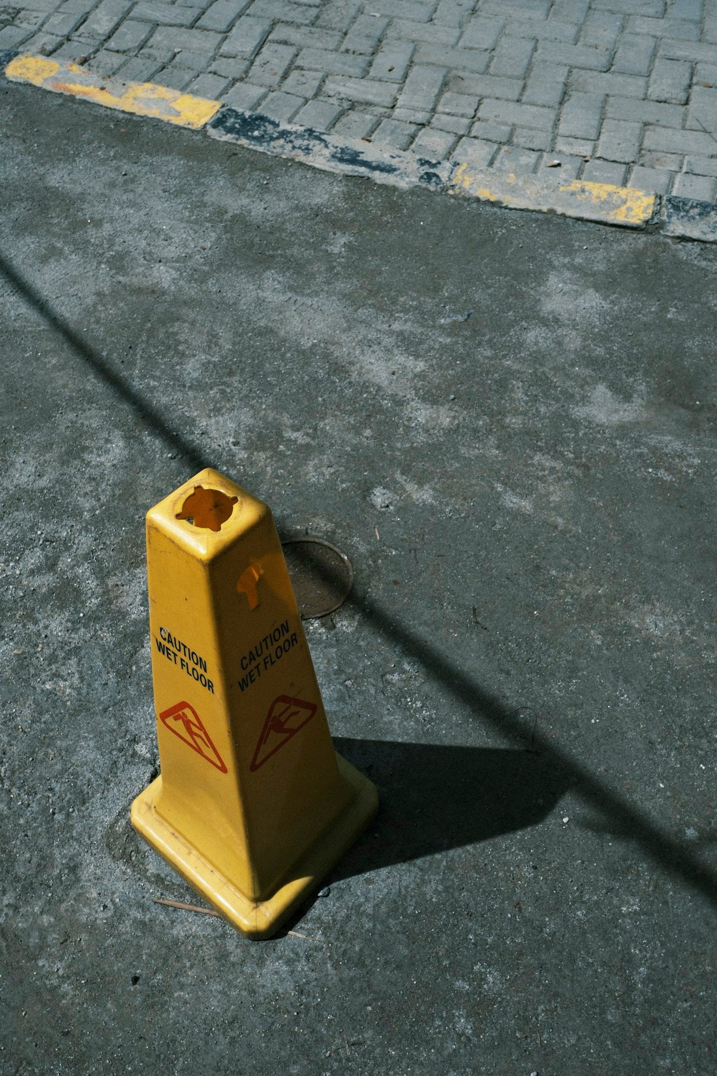 Wet slippery floor with caution sign representing a slip and fall legal funding case